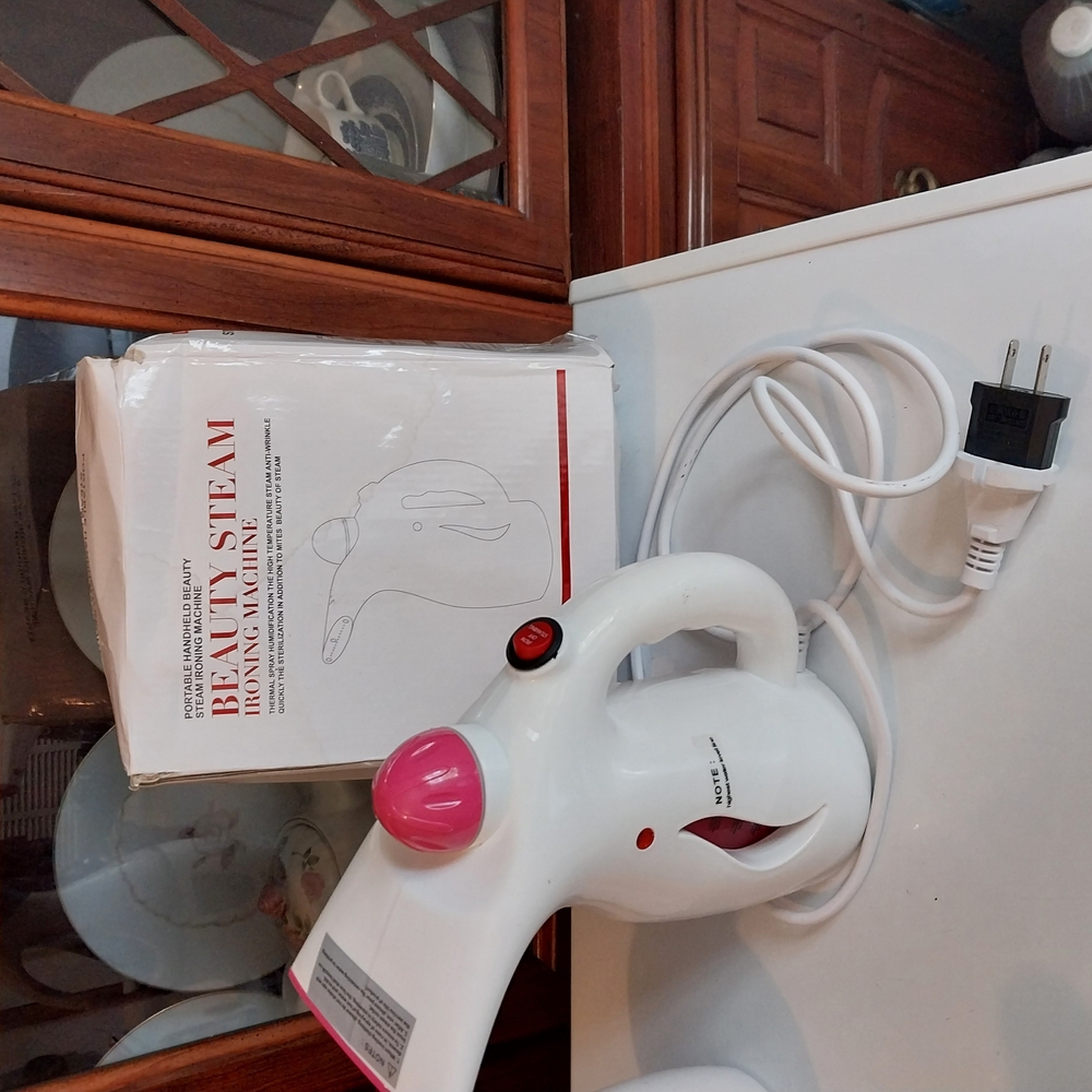 White and Pink Handheld Steamer